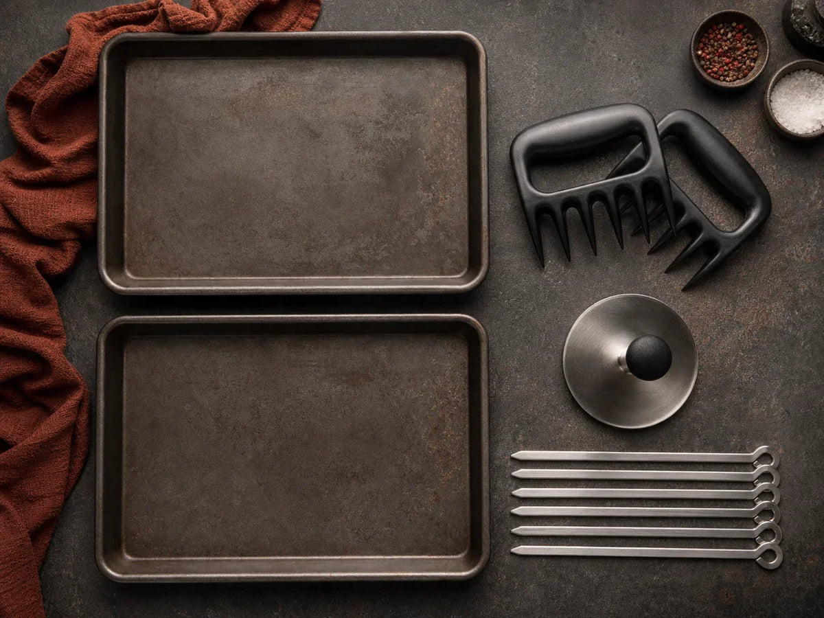 Separate prep trays, meat claws, burger press, and skewers on a clean work table